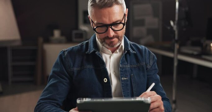 Tablet, media and man on set with research for documentary interview or podcast episode. Digital technology, script and male journalist with show for entertainment on channel for content creation.