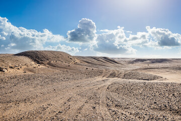 Desert and sand dunes natural landscape under blue sky