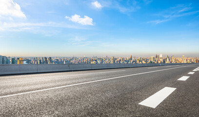 Fototapeta premium Empty asphalt highway road and city skyline in Shanghai