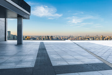 Modern rooftop view overlooking a sprawling city skyline panorama