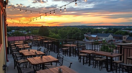 Fototapeta premium Chic rooftop restaurant with open-air seating, cozy lighting, and a scenic city view.