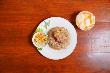 fried goat rice. cooked with lots of spices and goat meat. suitable to be served while hot or when it's raining. indonesian food on the table.