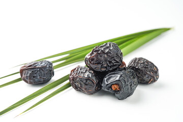 Dates fruit ajwa or kurma ajwa, isolated on white background
