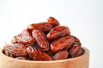 Dates fruit tunisia, Tunisian honey dates, in bowl isolated on white background