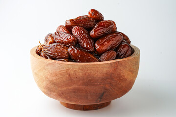 Dates fruit tunisia, Tunisian honey dates, in bowl isolated on white background