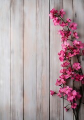 Fototapeta premium A bunch of pink flowers on a wooden surface