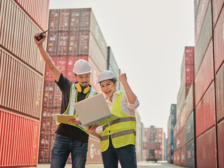 Asian happy worker and engineer co-working with laptop