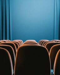 Fototapeta premium Minimalist Theater Experience Empty Cinema Seats in Rich Amber Tones - Contemporary Performance Space Design and Immersive Cultural Storytelling