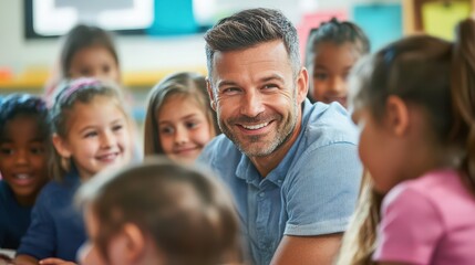 Obraz premium A cheerful man wearing a blue shirt smiles warmly as he interacts with a diverse group of children in a colorful classroom, filled with educational posters and learning materials.