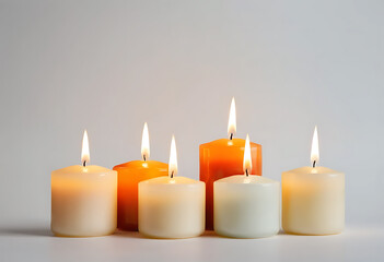 Burning candle, Cylindrical aromatic candle sticks with burning flames, Decorative candle set, White candles with fire on gray background