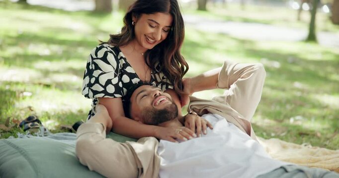 Couple, date and laugh in park with tickle, bonding and funny joke. Happy people, commitment and laying outdoor for relationship development, weekend relax or smile for love and anniversary picnic