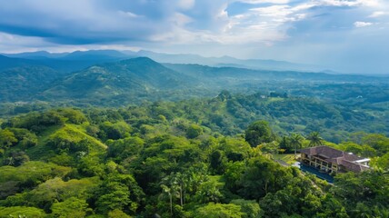 Obraz premium fog over the mountains with dense trees, aerial view