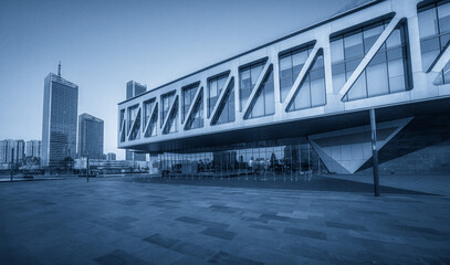 Striking Modern Architecture Against a City Skyline in Blue Tones
