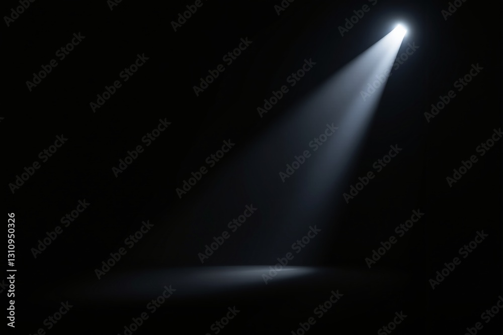Poster spotlight beam in dark space creating a focused lighting effect.