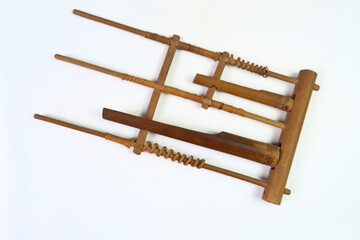 Close-up of the angklung, a traditional Indonesian bamboo instrument, showcasing its intricate craft and cultural significance.