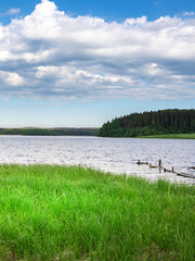 Lake with a cloudy sky in the background