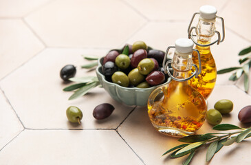 Green and black olives with olive oil on tiled kitchen counter