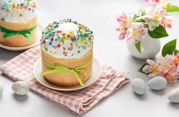 Traditional easter cakes decorated with colorful sprinkles and eggs on festive table
