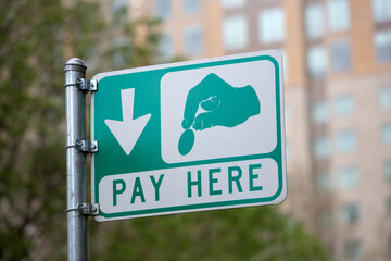 Pay Here for parking street sign.