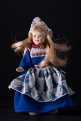 A doll of a girl in a national Danish costume.