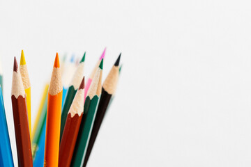 Color wood pencils in a cup composed with copy space.