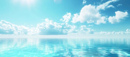 Obraz premium Serene tranquil swimming pool with turquoise water reflecting a clear blue sky and soft white clouds creating a peaceful atmosphere.