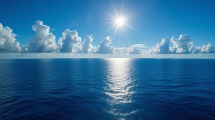 Obraz premium Breathtaking view of the deep blue ocean under a bright sun with scattered clouds on the horizon, creating a peaceful and relaxing seascape perfect for backgrounds and wallpapers