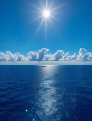 Fototapeta premium Breathtaking view of the deep blue ocean under a bright sun with scattered clouds on the horizon, creating a peaceful and relaxing seascape perfect for backgrounds and wallpapers