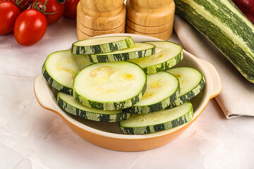 Raw green zucchini slices for cooking