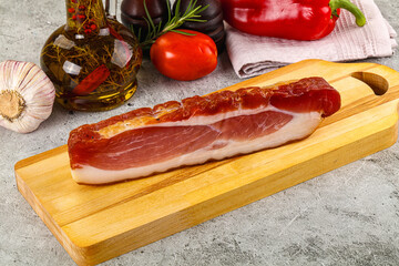 Piece prosciutto crudo over board