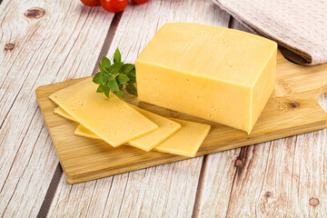 Yellow cheese piece with slices