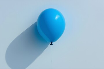 Obraz premium a close up of a blue balloon on a white surface