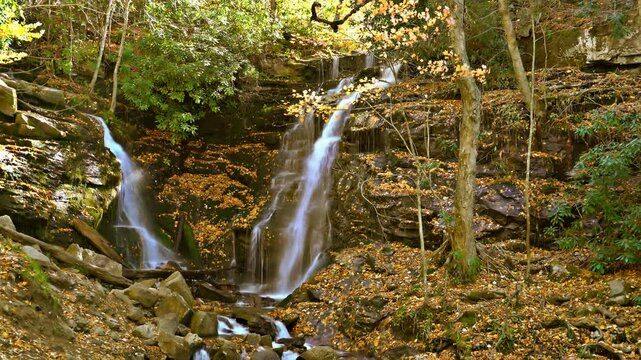 Beautiful waterfall ,Soco Falls is a beautiful, double waterfall on the edge of the Cherokee Indian Reservation in North Carolina, seen here in autumn.