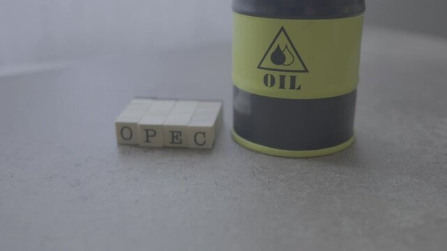Oil barrel miniature next to opec text