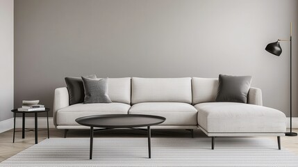 A modern living room featuring a light-colored sofa, decorative pillows, a minimalist coffee table, and a stylish floor lamp against a neutral wall.