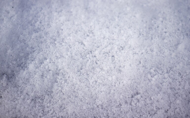 Texture of fallen snow on the ground. Snow on the ground from a top view. Snow, texture, winter.