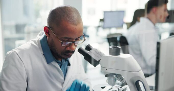 Science, lab and man with microscope for research, medical study and discovery. Healthcare, pharmaceutical and scientist with equipment for virus vaccine, microbiology and experiment for medicine
