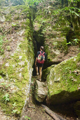 Obraz premium Tourists explore the cave. Speleology and geology. Sports and active leisure