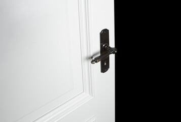 Wooden white door isolated on black background. White interior door isolated. Entrance door