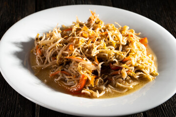 Bean Sprouts Stir Fry on black background. Food concept.Chinese Bean Sprouts Stir-fry