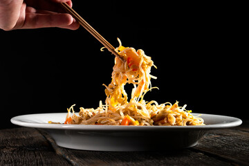 Bean Sprouts Stir Fry on black background. Food concept.Chinese Bean Sprouts Stir-fry