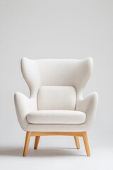 Elegant armchair with unique winged design, soft fabric, and woo