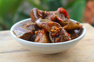 Terong balado or spicy eggplant, Serving in white plate. Indonesian food and cuisine
