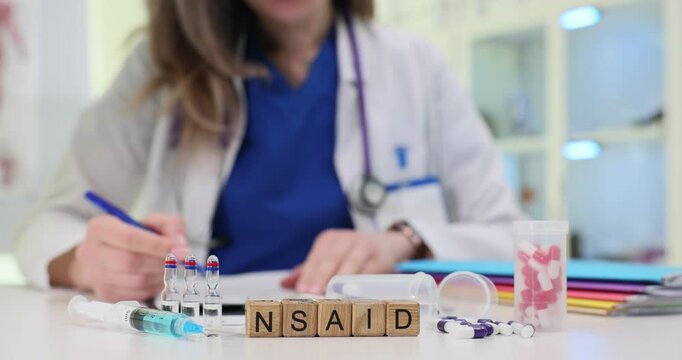 In a clinical healthcare setting, a provider diligently prepares medication and takes detailed notes about NSAIDs