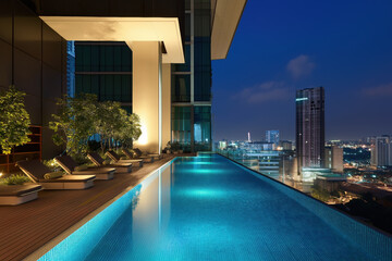 Experience urban luxury with an infinity pool overlooking the sparkling city skyline.