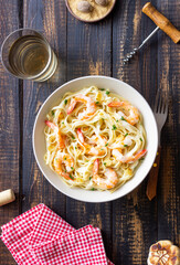 Linguine pasta in creamy garlic sauce with shrimps. Italian food.