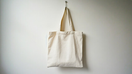 canvas tote bag mockup hanging on white wall
