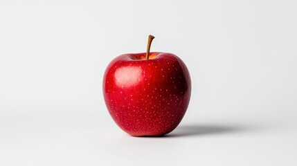 A vibrant red apple isolated on a clean white background, showcasing its freshness and natural beauty.