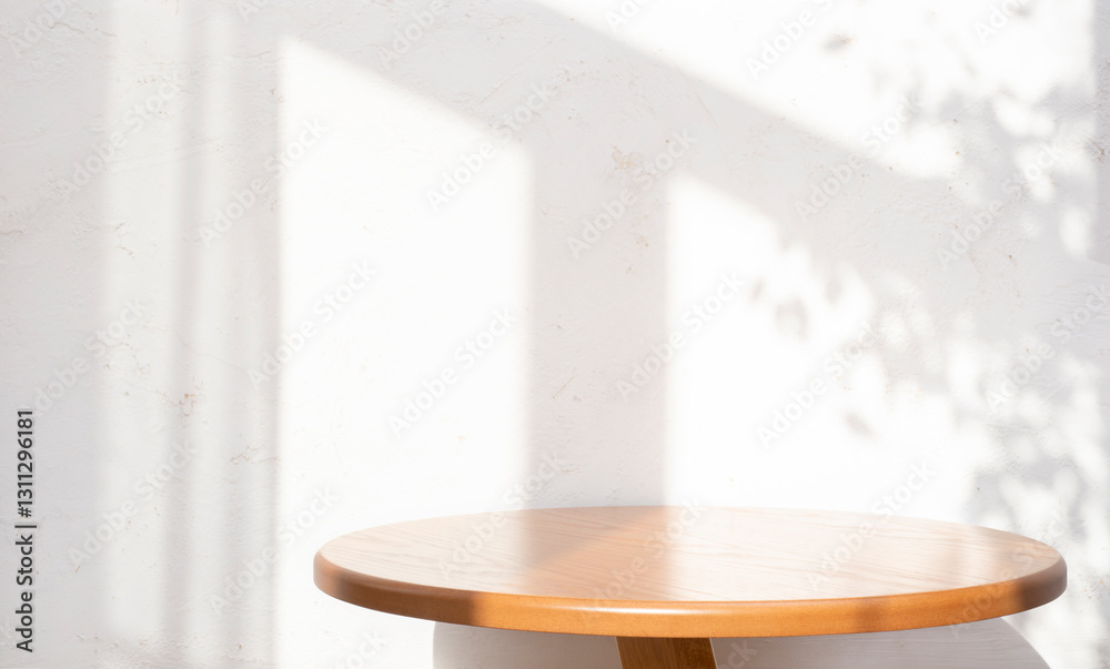 Wall mural empty round oak table on abstract texture white wall background with window dappled sunlight shadows