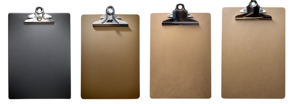 Four clipboards with various textures ready for notes or presentations in a workspace.